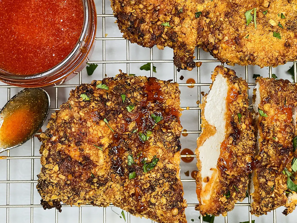 Air Fryer Cornflake Chicken with Hot Honey Sauce